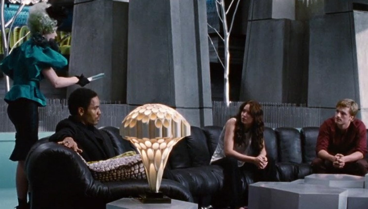 Lenny Kravitz, Jennifer Lawrence e Josh Hutcherson em cena de Jogos Vorazes